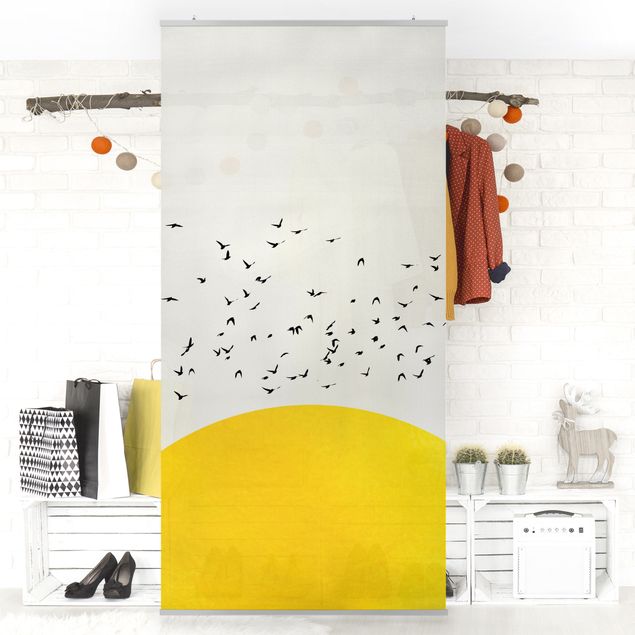 Wanddeko Küche Vogelschwarm vor gelber Sonne