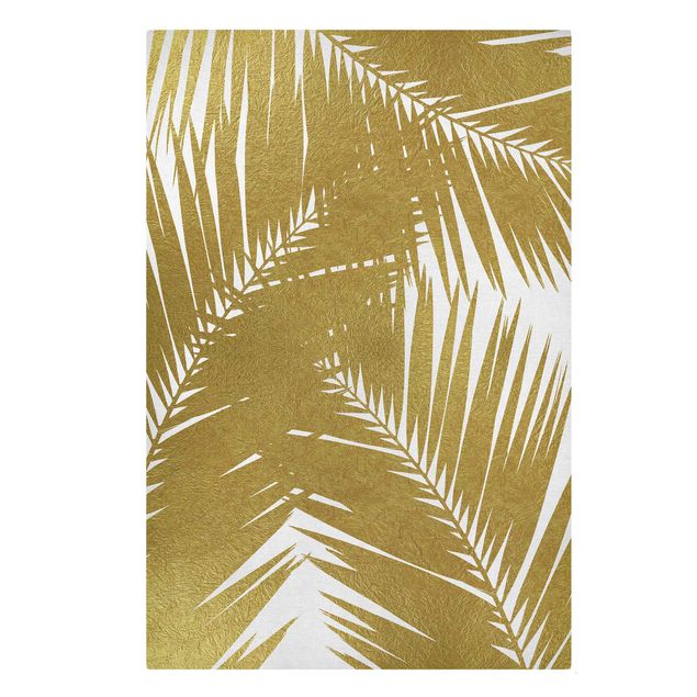 Wandbilder Blumen Blick durch goldene Palmenblätter