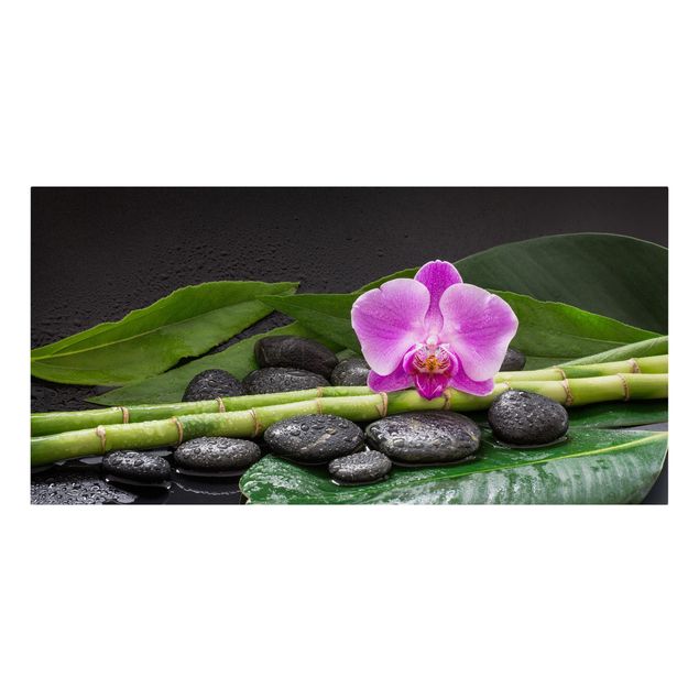 Bilder mit Steinen auf Leinwand Grüner Bambus mit Orchideenblüte