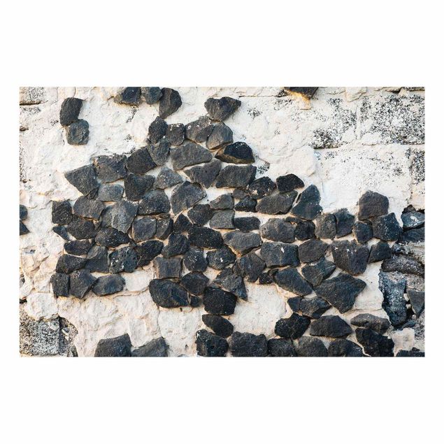 Uta Naumann Bilder Mauer mit Schwarzen Steinen