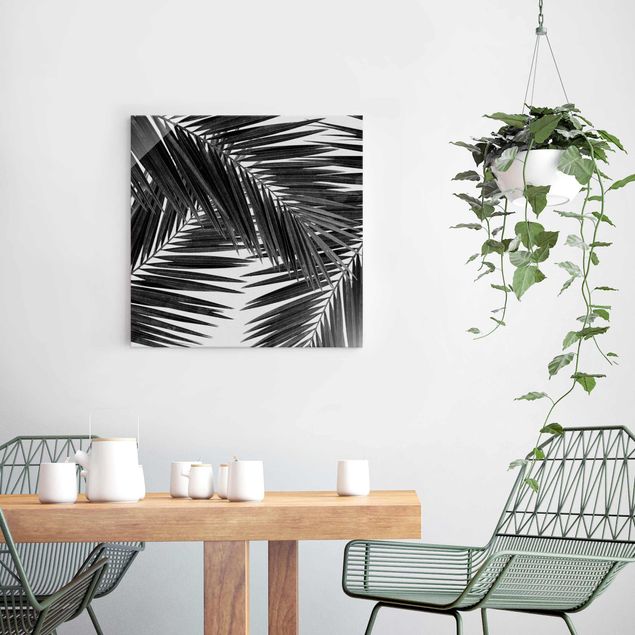 Wandbilder Landschaften Blick durch Palmenblätter schwarz weiß