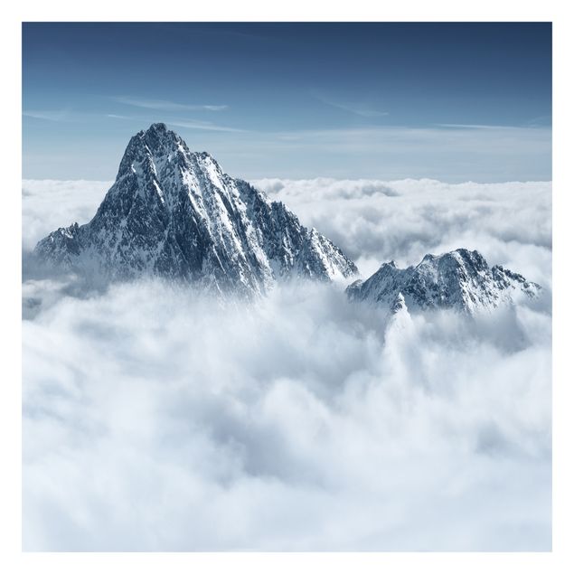 Fototapeten Blau Die Alpen über den Wolken
