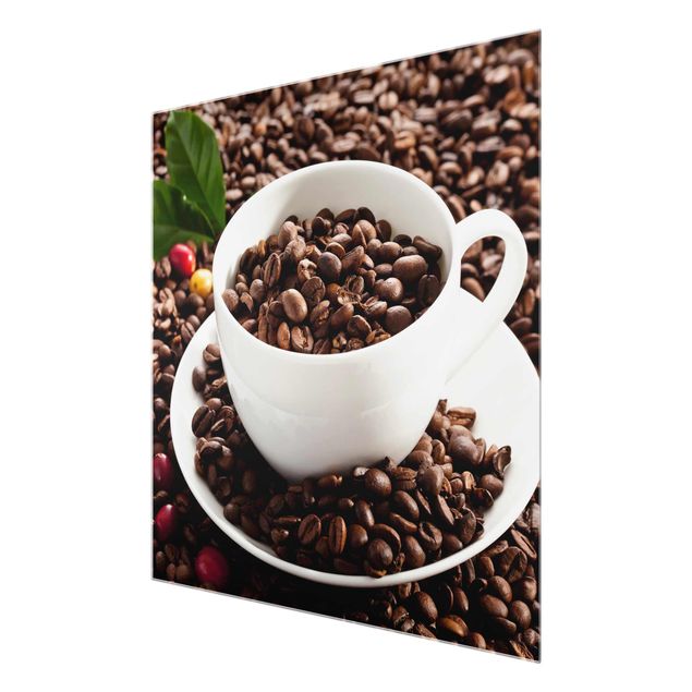 Glasbilder Kaffeetasse mit gerösteten Kaffeebohnen