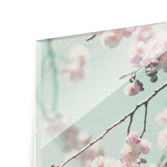 Glas Wandbilder Kirschblütentanz auf Leinenstruktur