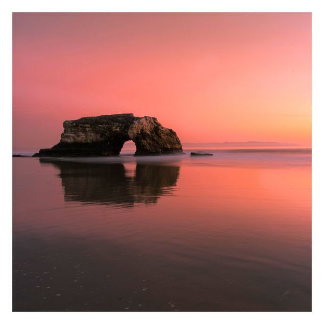 Fototapete Strand Natürliche Brücke im Sonnenuntergang