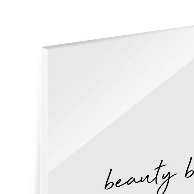 Glasbild - Typografie Beauty Begins Zitat - Hochformat