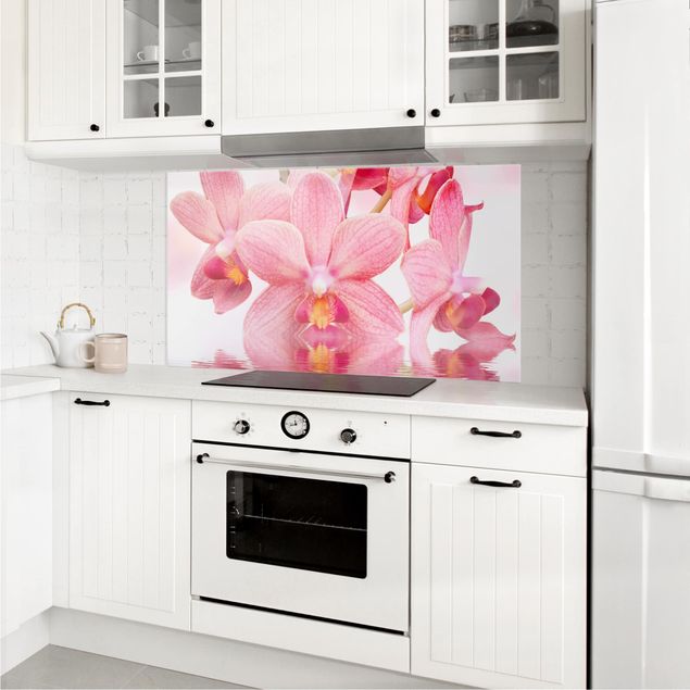 Glasrückwand Küche Blumen Rosa Orchideen auf Wasser