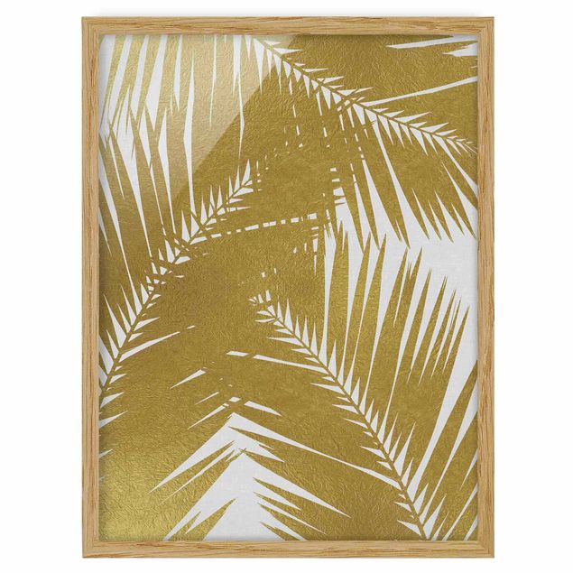 Wandbilder Floral Blick durch goldene Palmenblätter