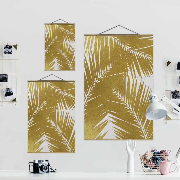 Wandbilder Blick durch goldene Palmenblätter