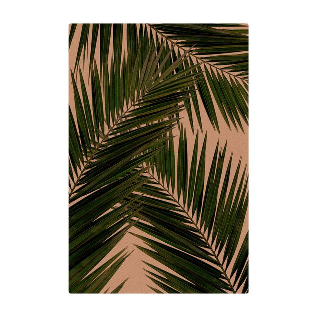 Kleine Teppiche Blick durch grüne Palmenblätter