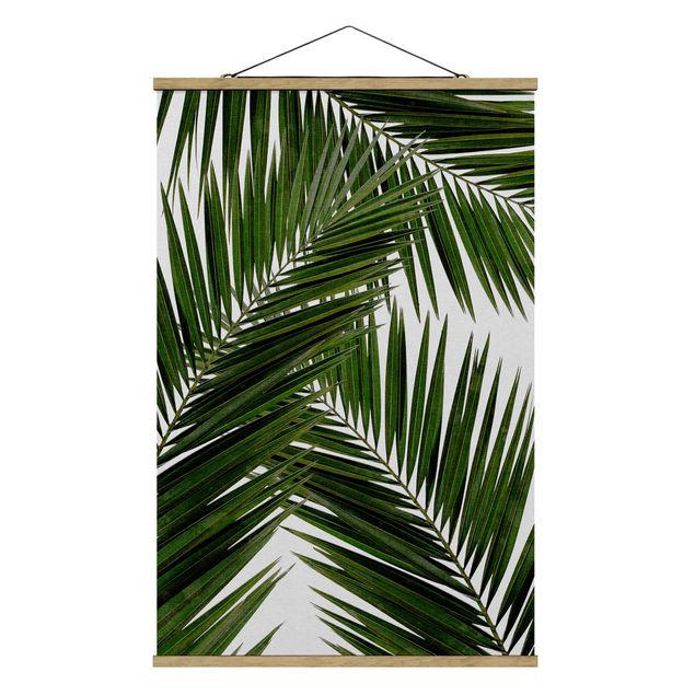 Wandbilder Blumen Blick durch grüne Palmenblätter