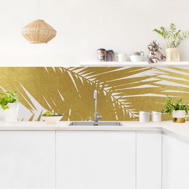 Küchenspiegel Glas Blick durch goldene Palmenblätter