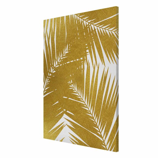 Magnettafeln Blumen Blick durch goldene Palmenblätter
