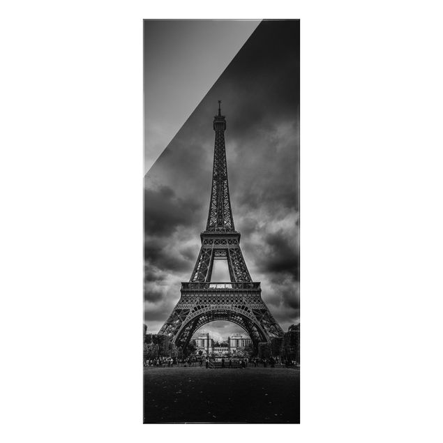 Glasbild Stadt Eiffelturm vor Wolken schwarz-weiß