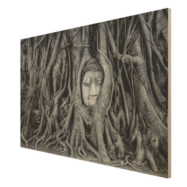 Holzbilder Blumen Buddha in Ayutthaya von Baumwurzeln gesäumt in Schwarzweiß