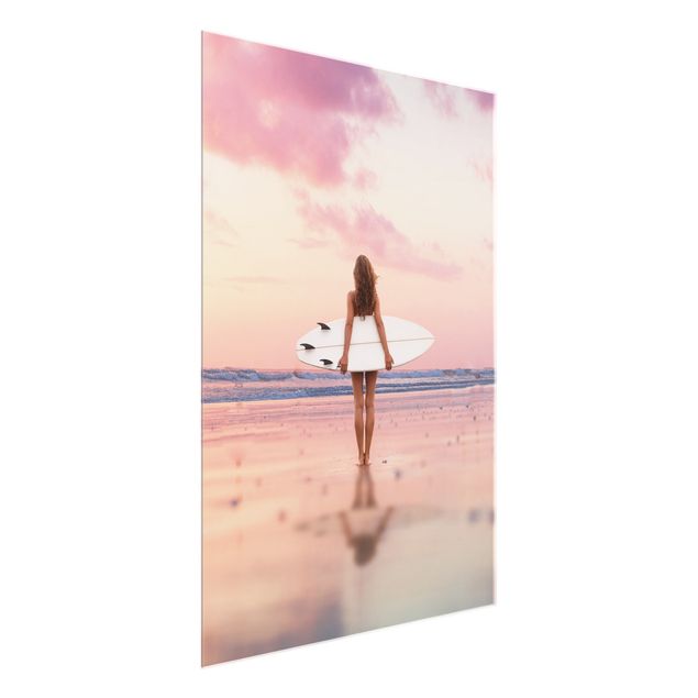 Glasbilder Strand und Meer Surfergirl mit Board im Abendrot