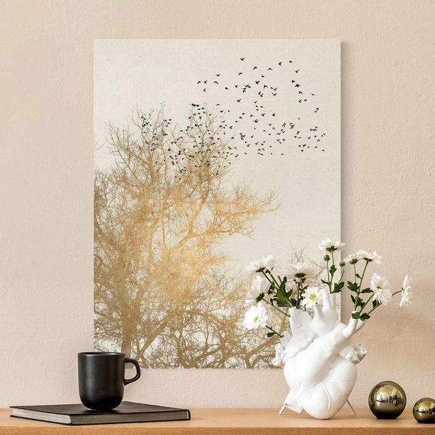 Leinwand Vögel Vogelschwarm vor goldenem Baum